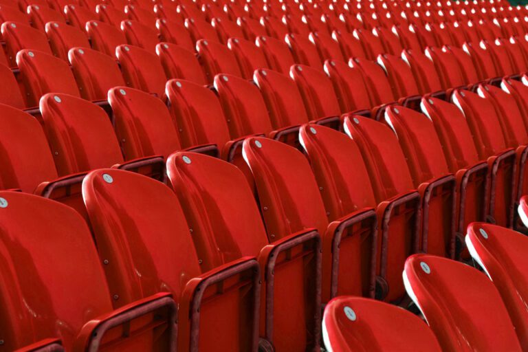 Red stadium seating which contains Flame Retardants, UV Stabilizers & Antioxidants.